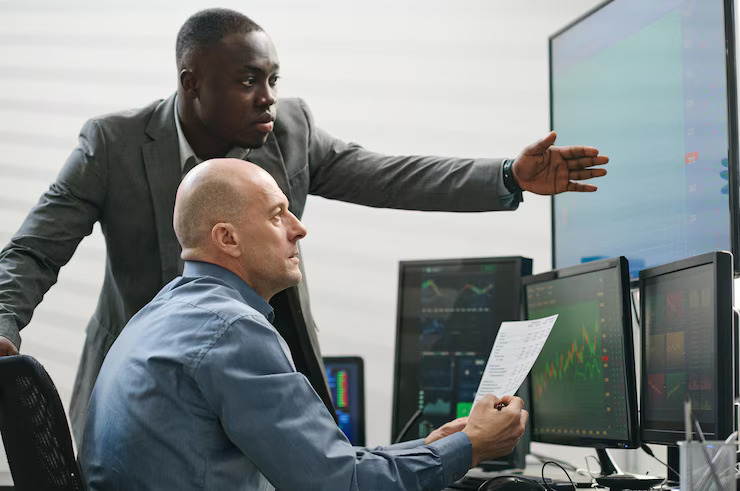 PRC Group team members reviewing platform data
